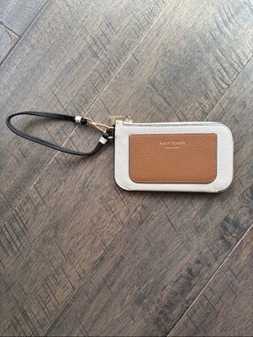 kate spade cream and tan wristlet card case with black strap